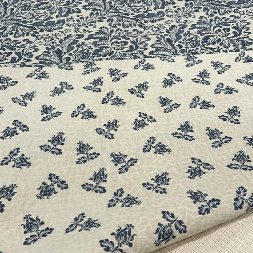 Queen sized reversible blue and white quilt/coverlet